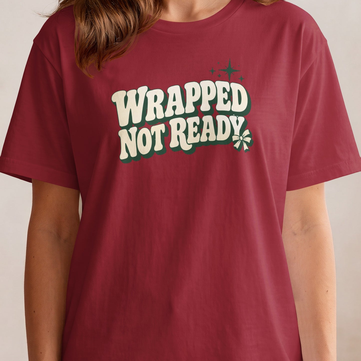 Red t-shirt with text "WRAPPED NOT READY" and festive graphic.