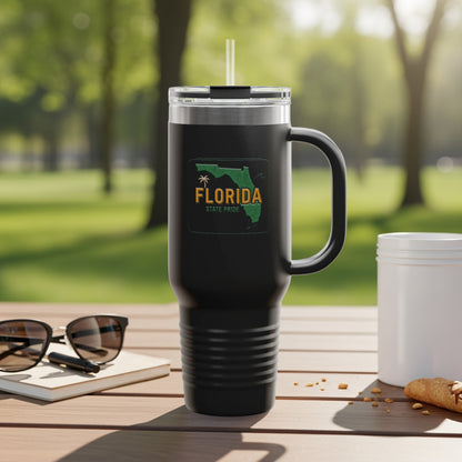 Black tumbler with "Florida State Pride" logo and handle, on a table.
