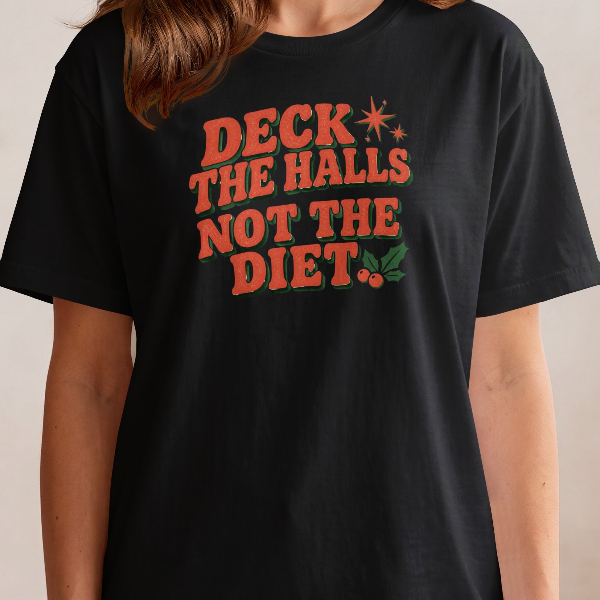 Black t-shirt with text "Deck the Halls Not the Diet" in retro font.