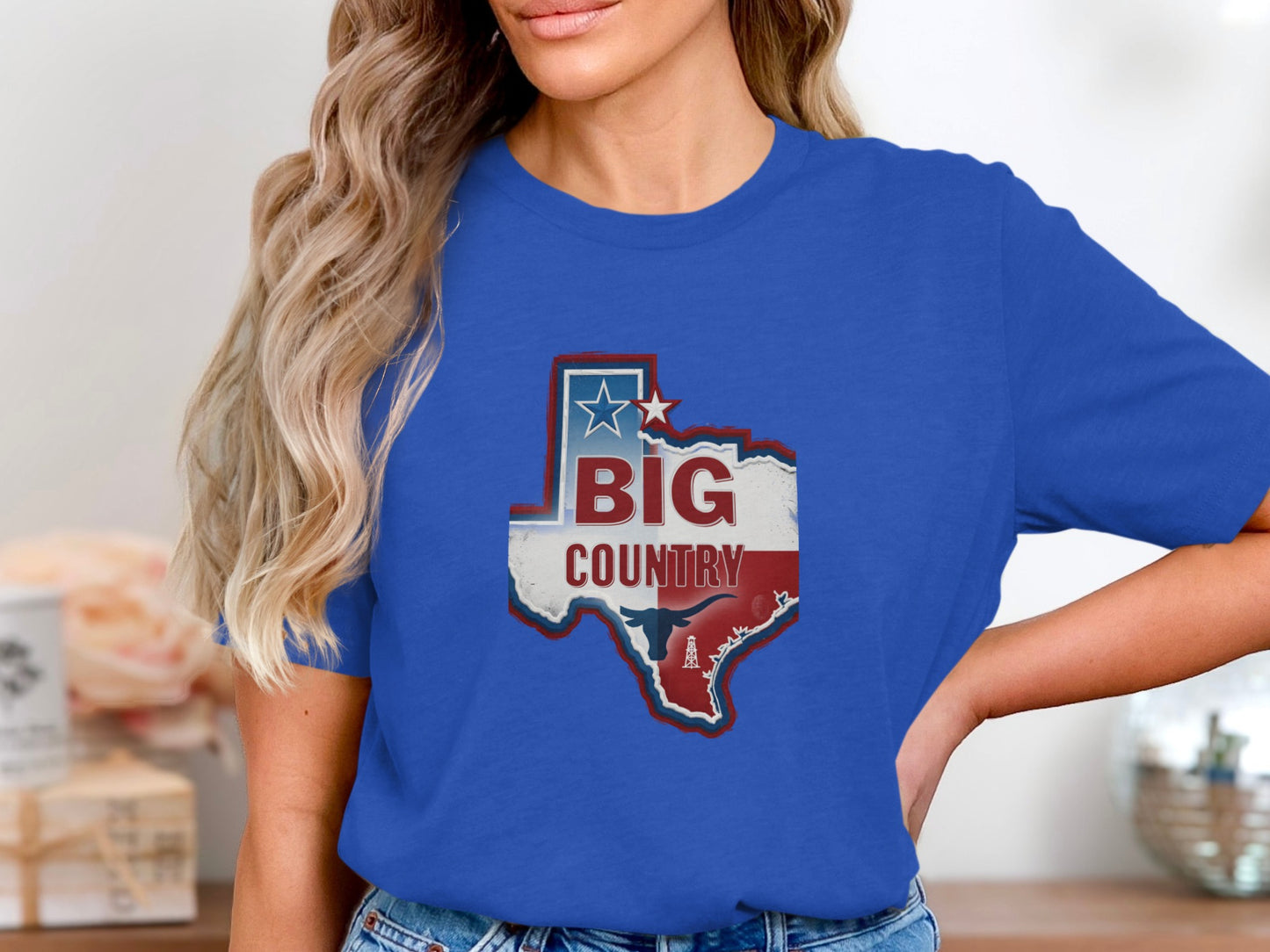 Blue t-shirt with Texas map graphic featuring "BIG COUNTRY" text and oil derrick.
