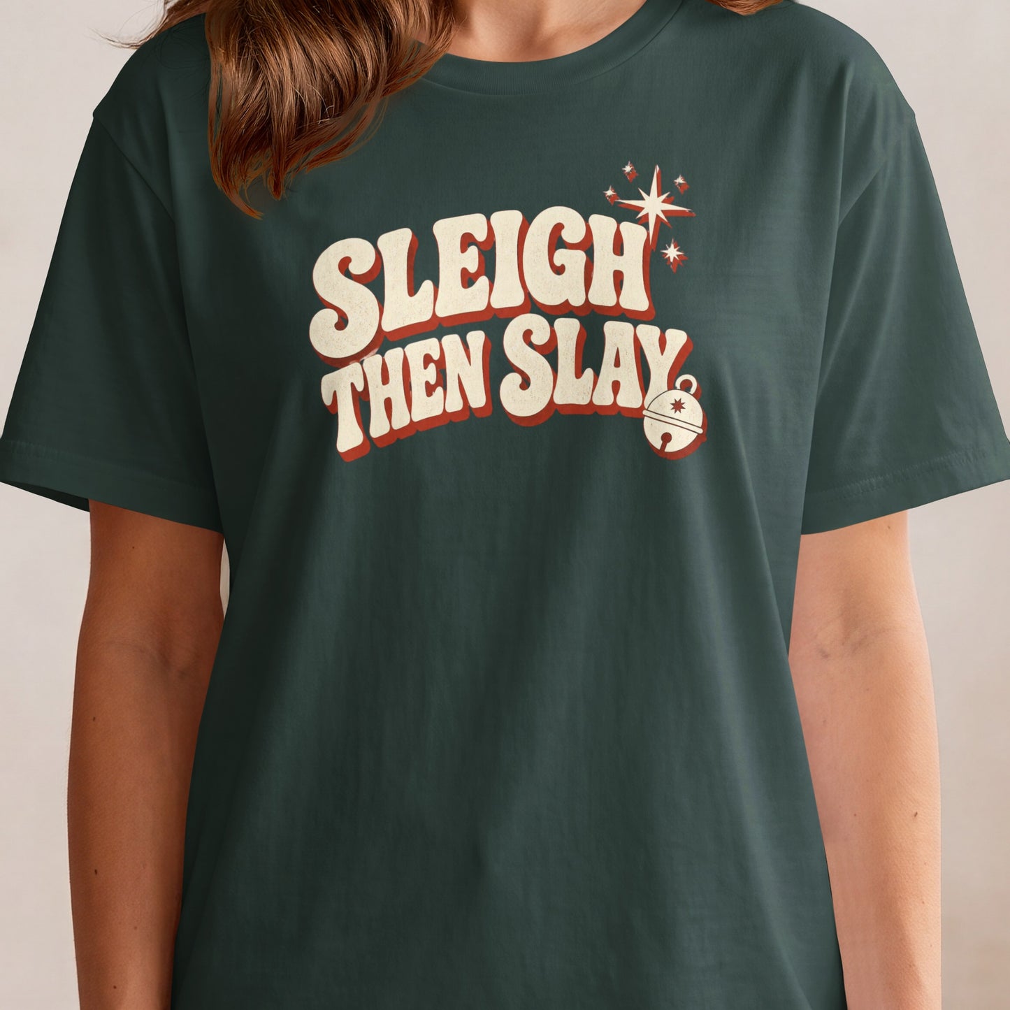 Dark green t-shirt with "Sleigh Then Slay" text and a festive bell.