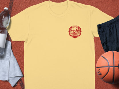 Yellow t-shirt with red "Cooper Disposal" logo, basketball, water bottle, and shorts.