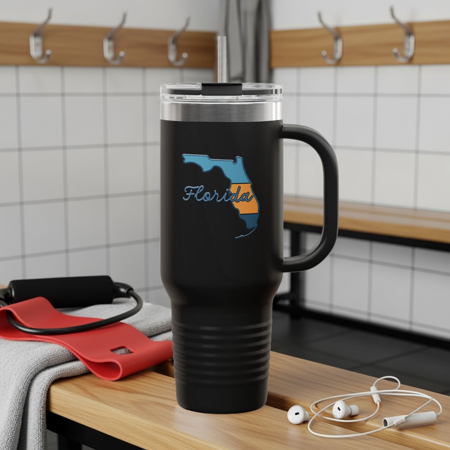 Black tumbler with Florida outline and "Florida" text, resting on gym bench.