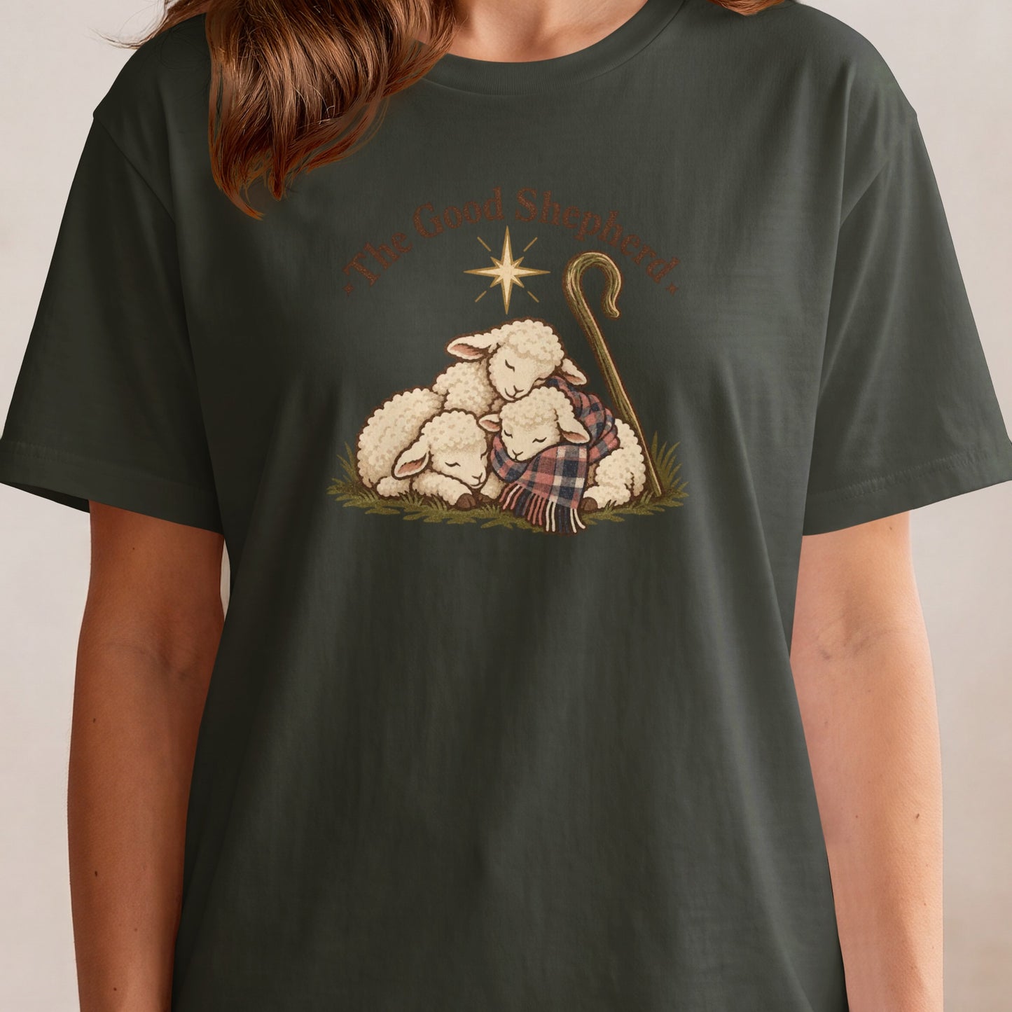 "The Good Shepherd" text above three sleeping sheep with a star and crook.