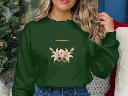 Green sweatshirt with a gold cross and lilies design.