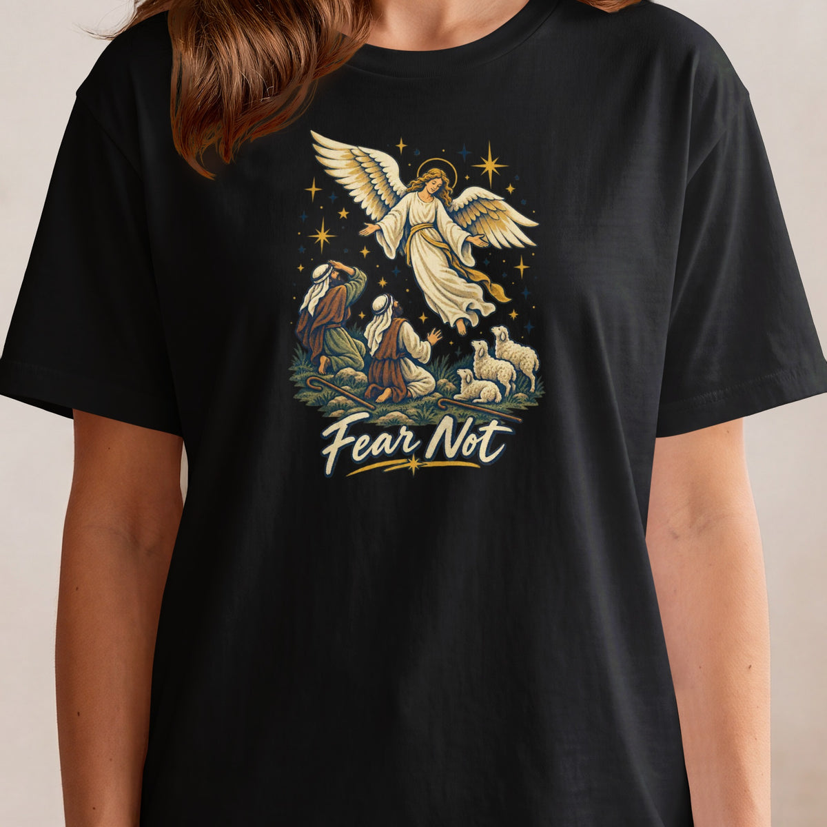 Angel appearing to shepherds with sheep, text reads "Fear Not".