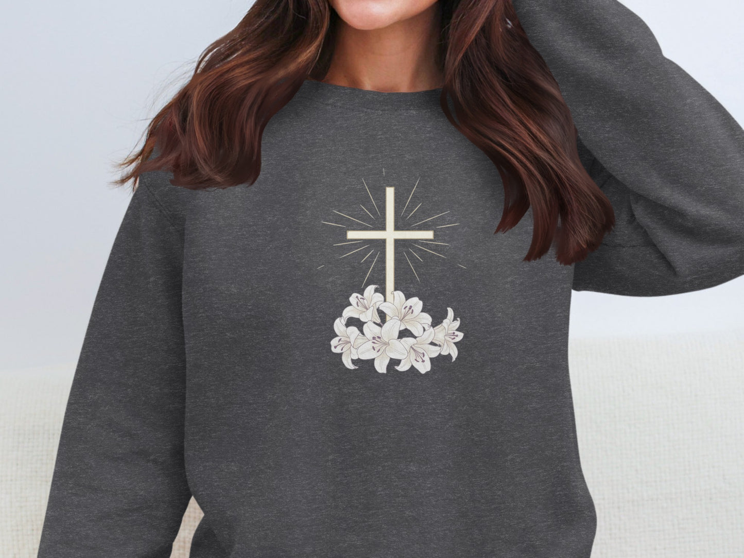 Dark gray sweatshirt with a white cross and lilies design.
