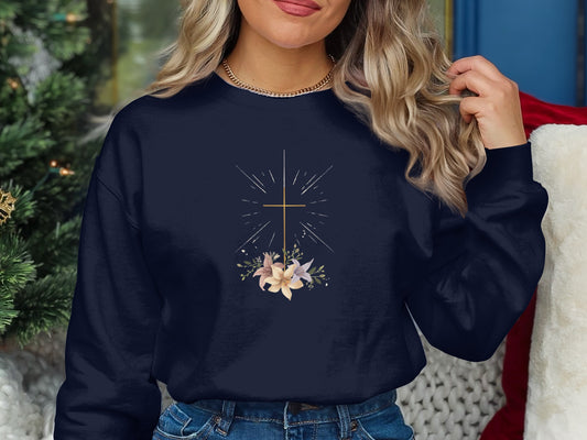 Navy sweatshirt with a golden cross and floral design.