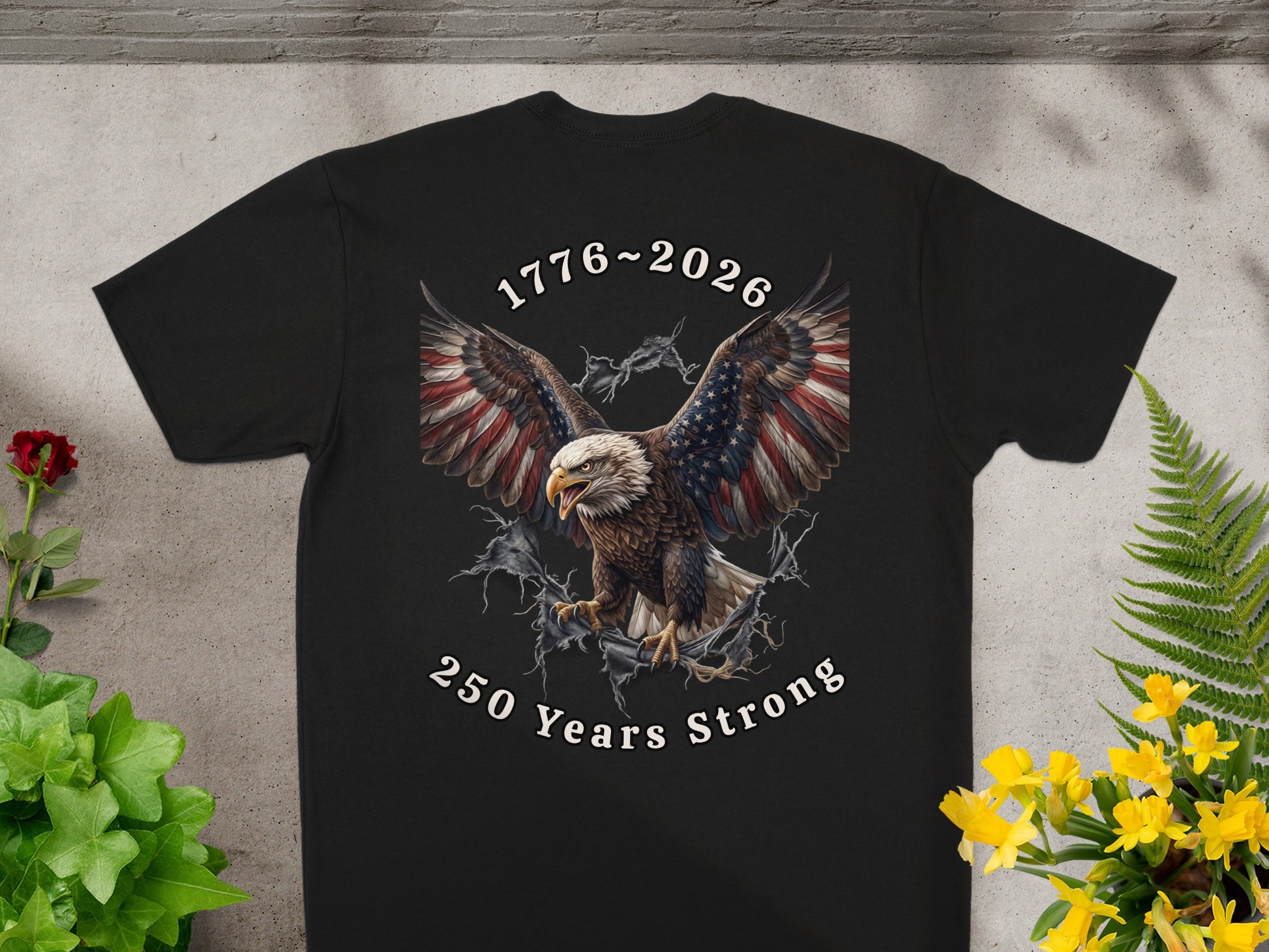 Black t-shirt with eagle, American flag wings, and "1776~2026 250 Years Strong" text.