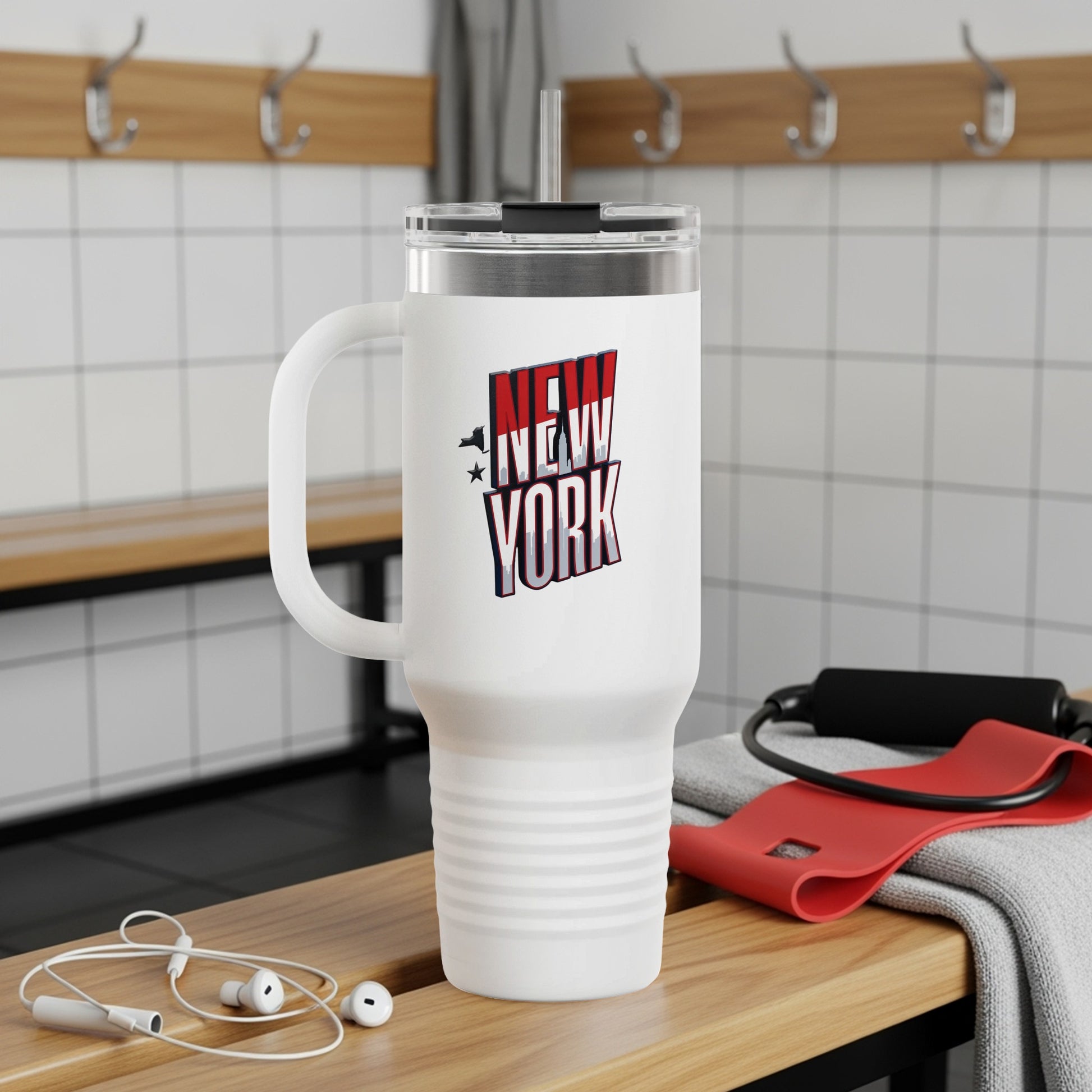 White insulated tumbler with "NEW YORK" text and a handle.