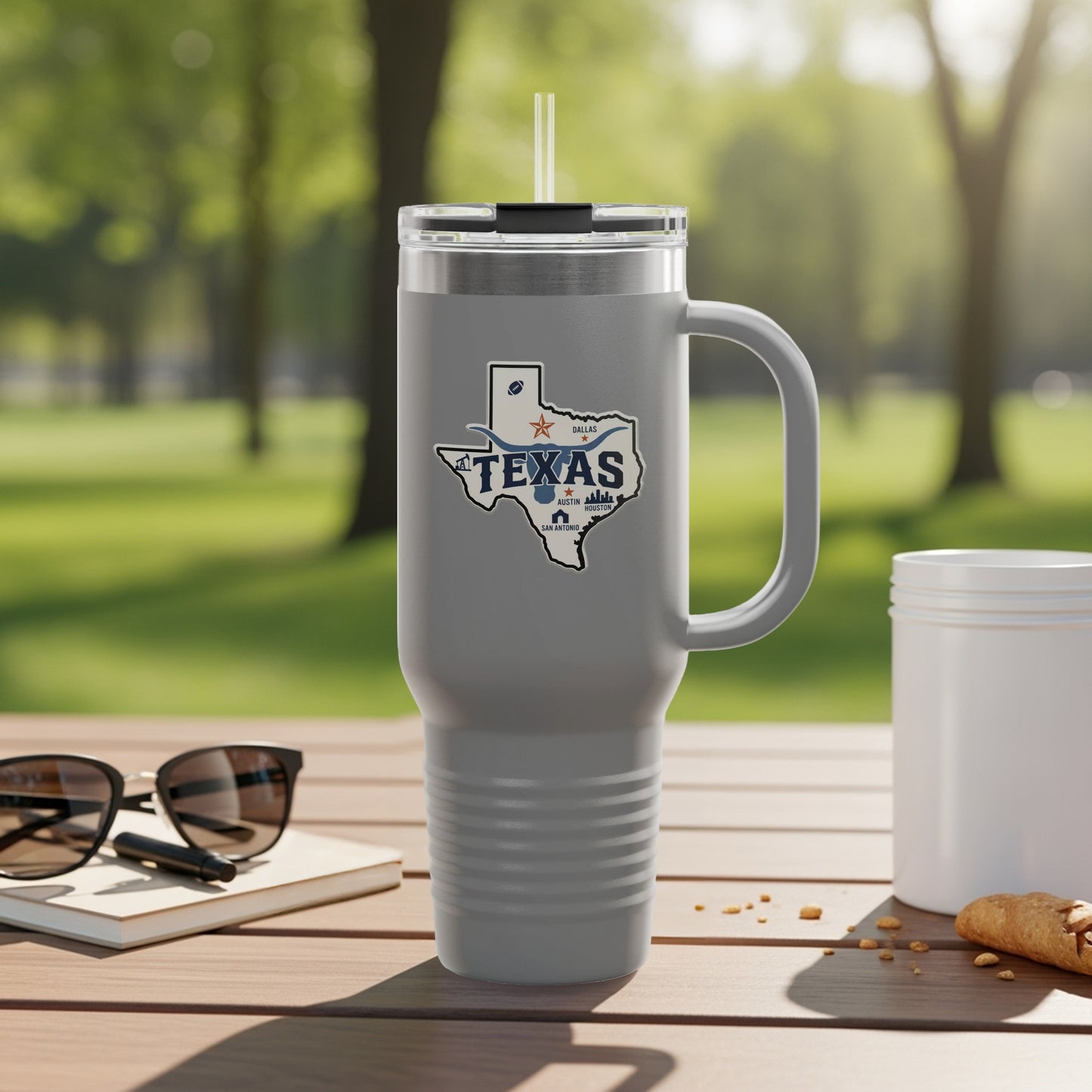 Travel mug with Texas outline and text.