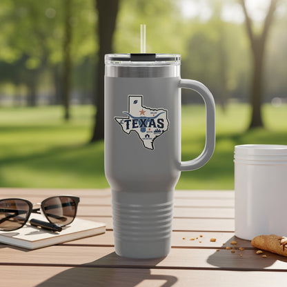 Travel mug with Texas outline and text.