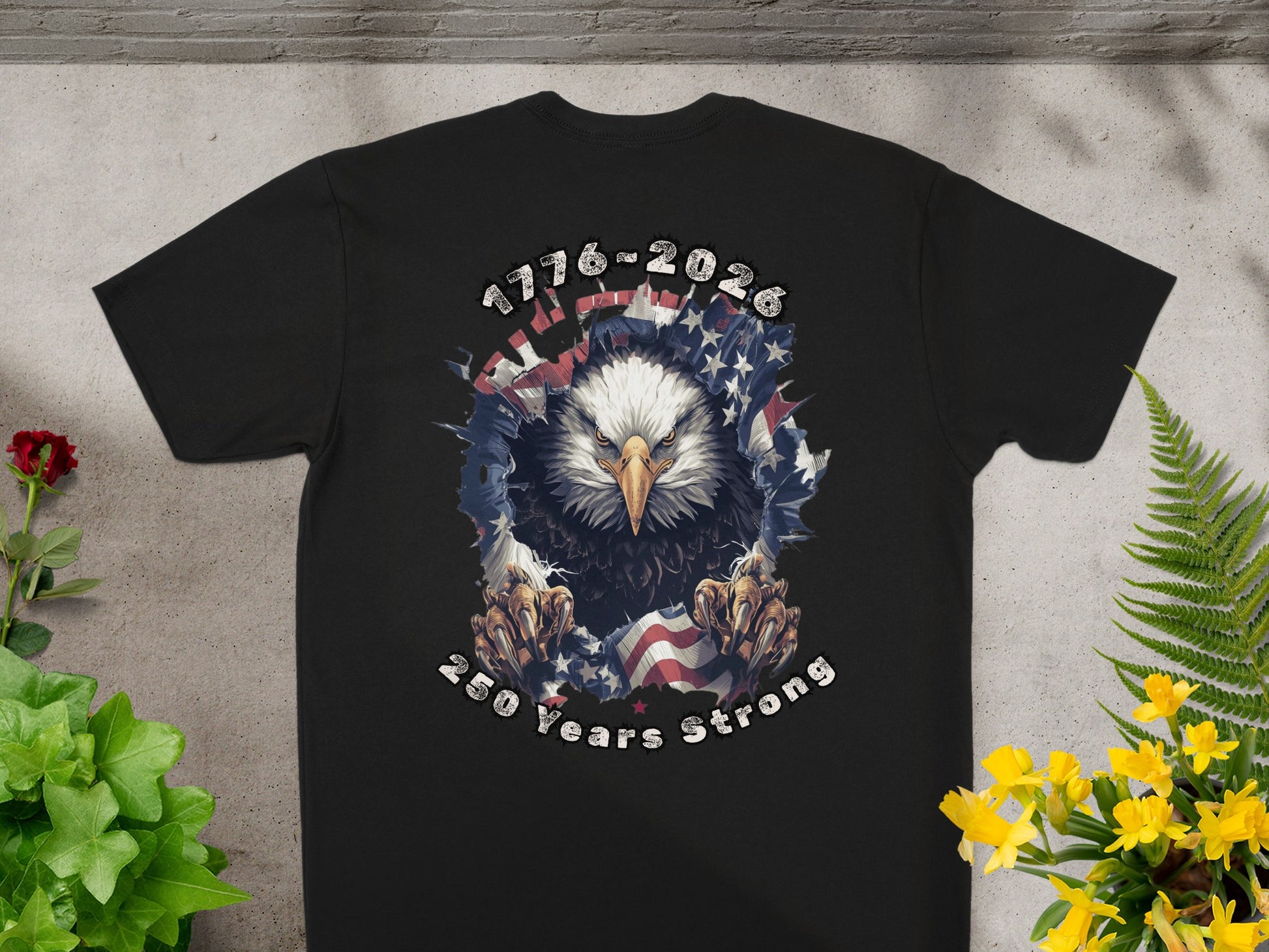 Black t-shirt with eagle, flag, and "1776-2026 250 Years Strong" text.