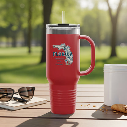 Red tumbler with Florida graphic and straw on a wooden table.