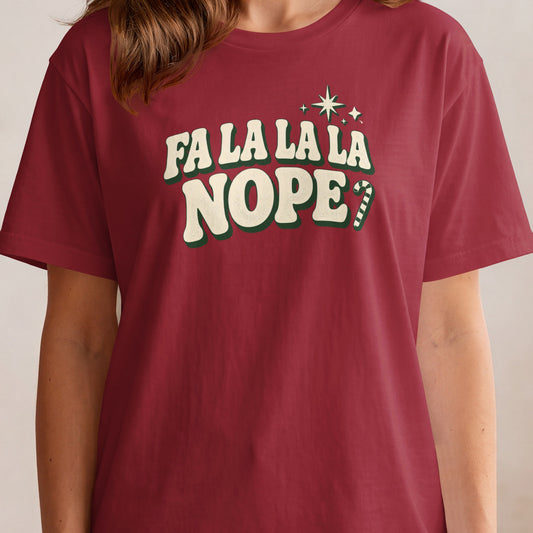 Red t-shirt with "FA LA LA LA NOPE?" and festive accents.