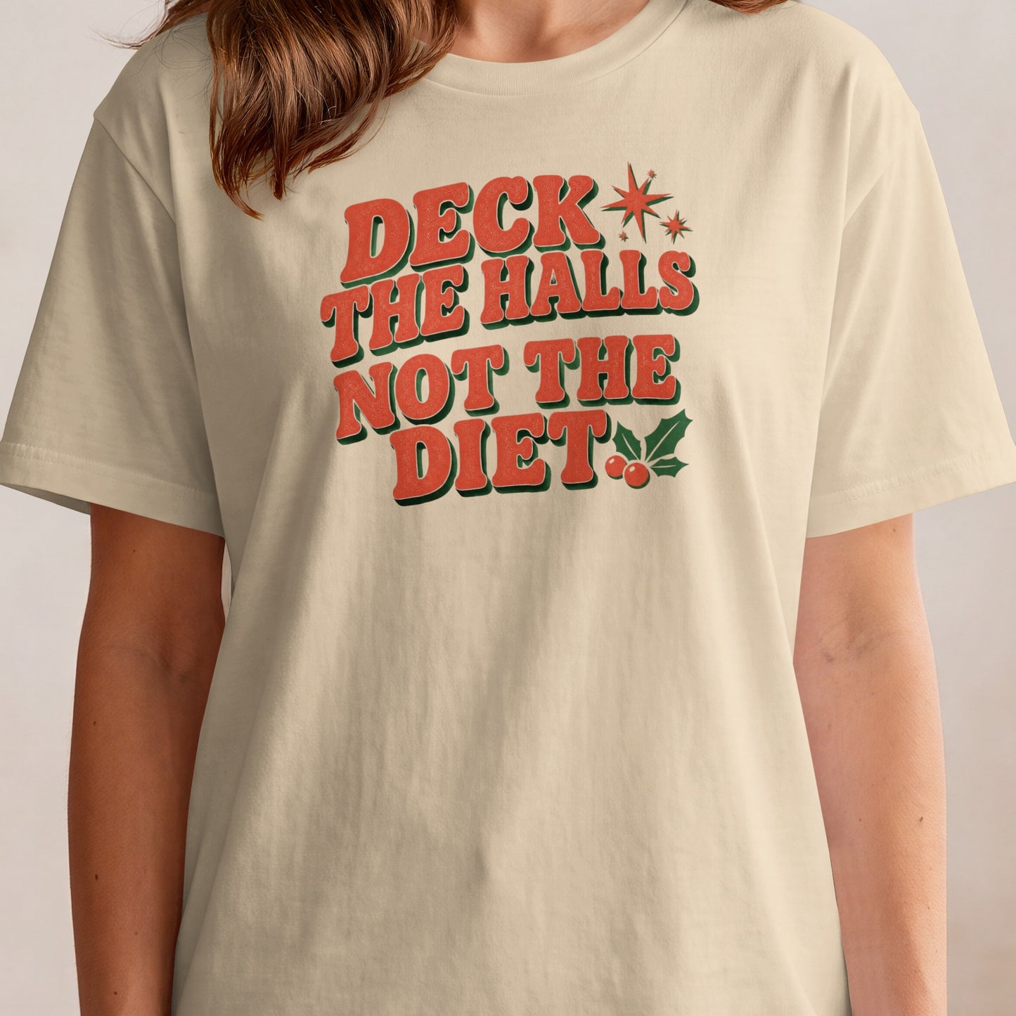 T-shirt with "Deck The Halls Not The Diet" Christmas graphic.