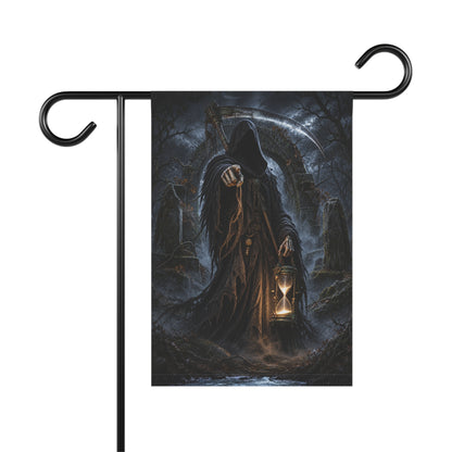 A garden flag on a black stand featuring a hooded grim reaper holding an illuminated hourglass.