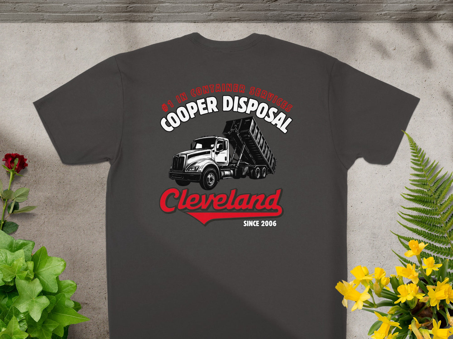 Dark grey t-shirt with Cooper Disposal Cleveland logo featuring a dump truck.