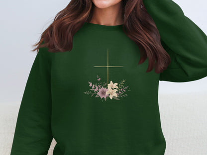 Green crewneck sweatshirt with a floral cross design.