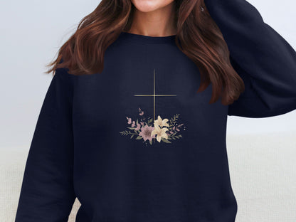 Navy sweatshirt with a gold cross and floral bouquet graphic.