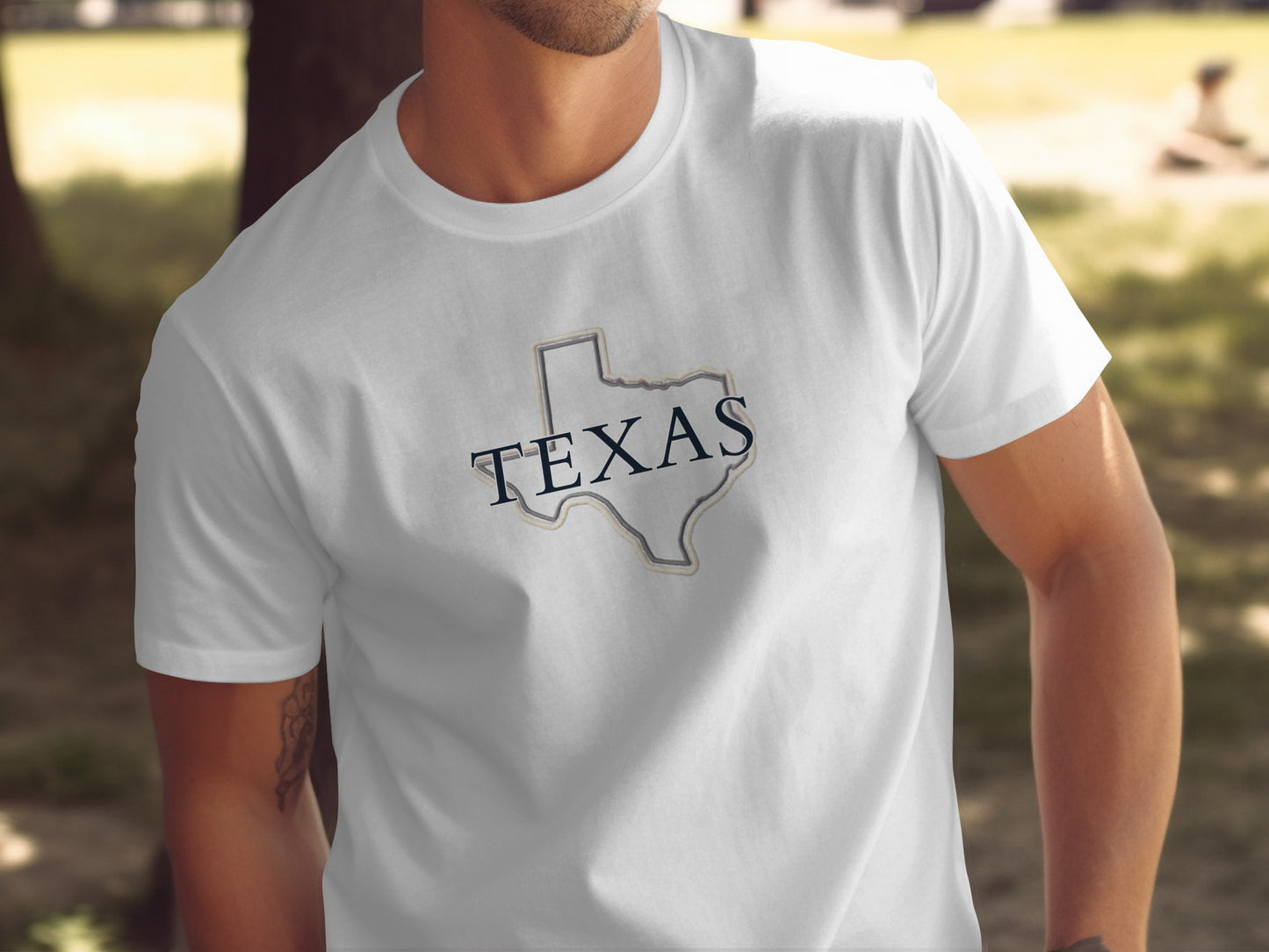 White t-shirt with outline of Texas in gray and navy blue.
