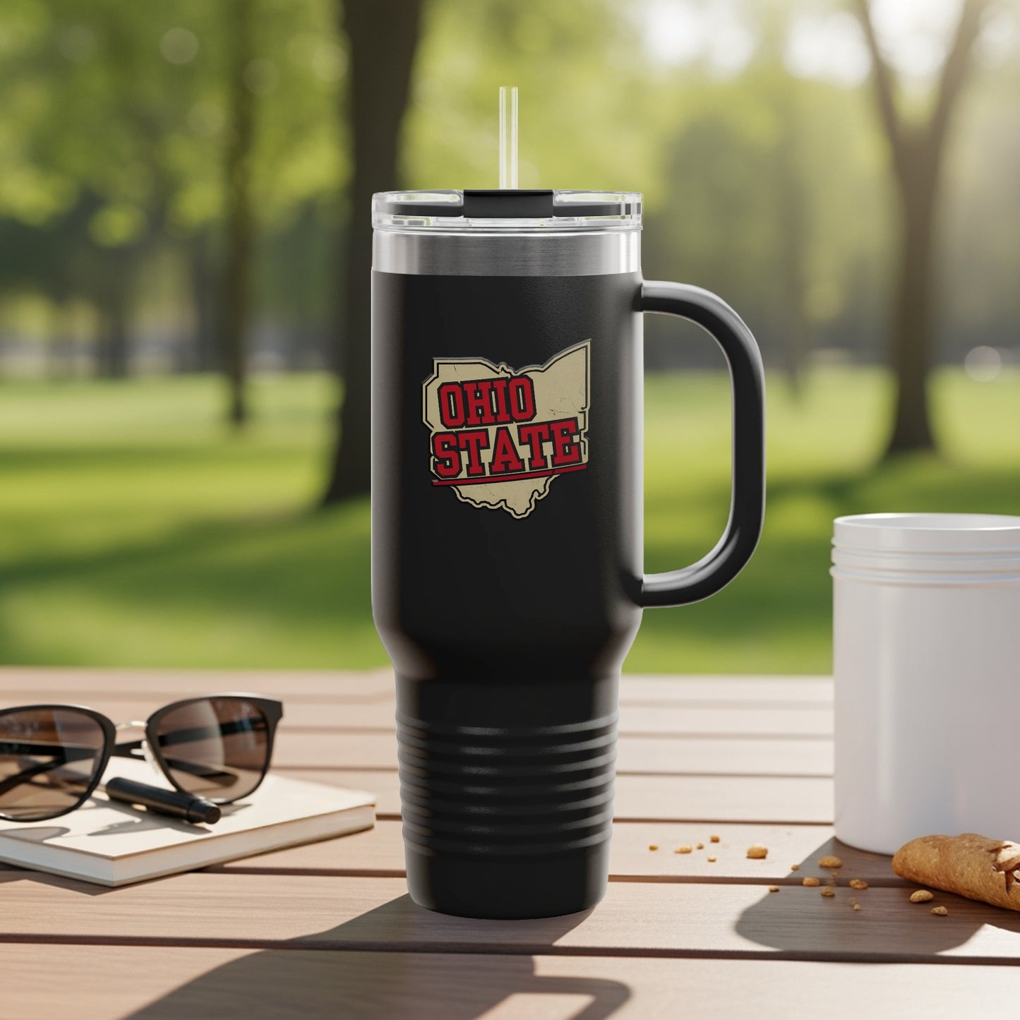 Travel mug with Ohio map graphic and city names.