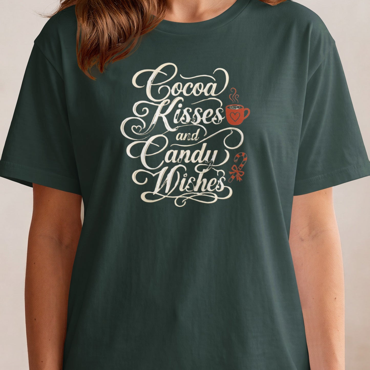 "Cocoa Kisses and Candy Wishes" graphic on a dark green t-shirt.