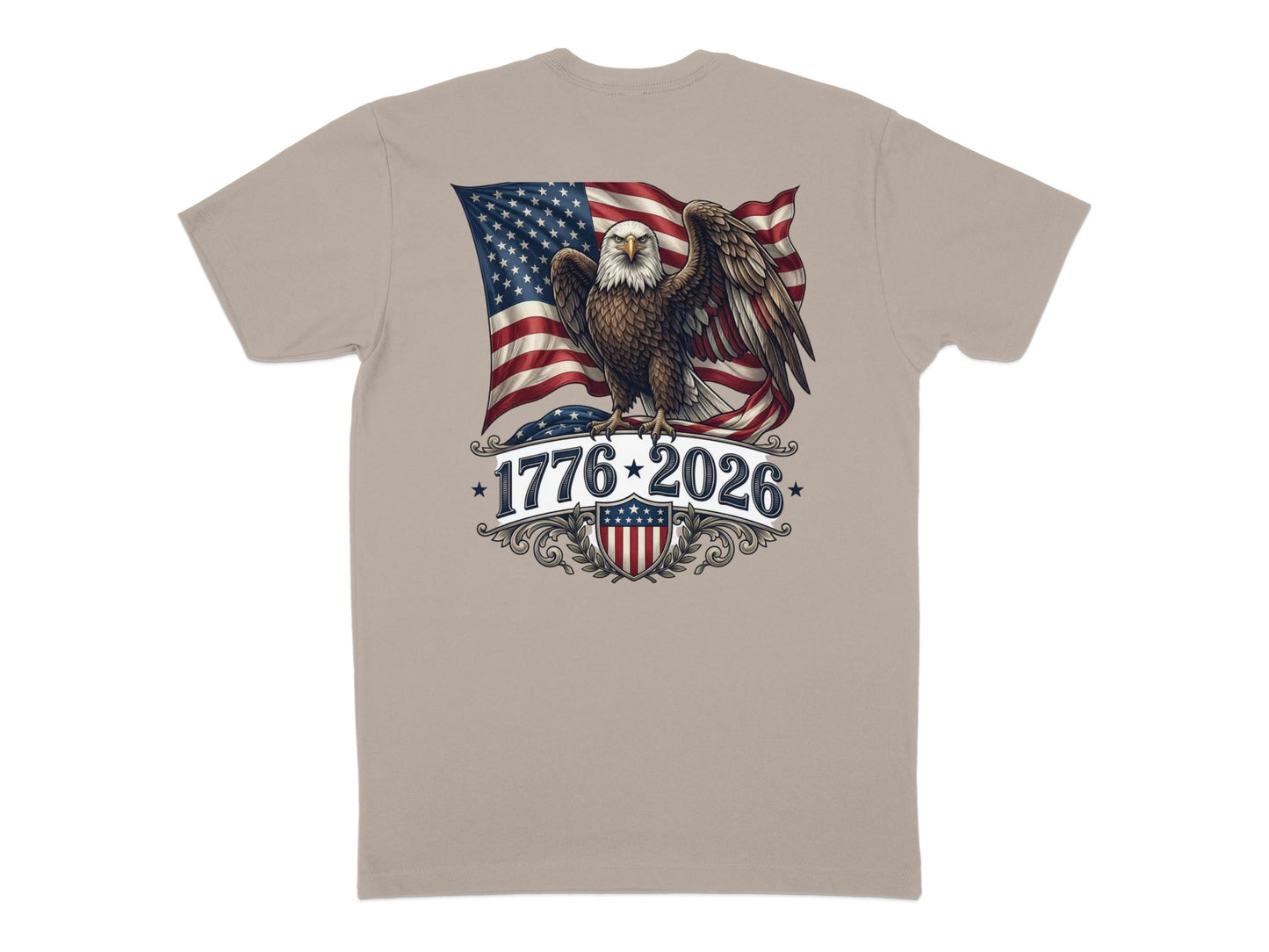 Eagle with American flag, “1776-2026” text, and shield graphic on a tan t-shirt.