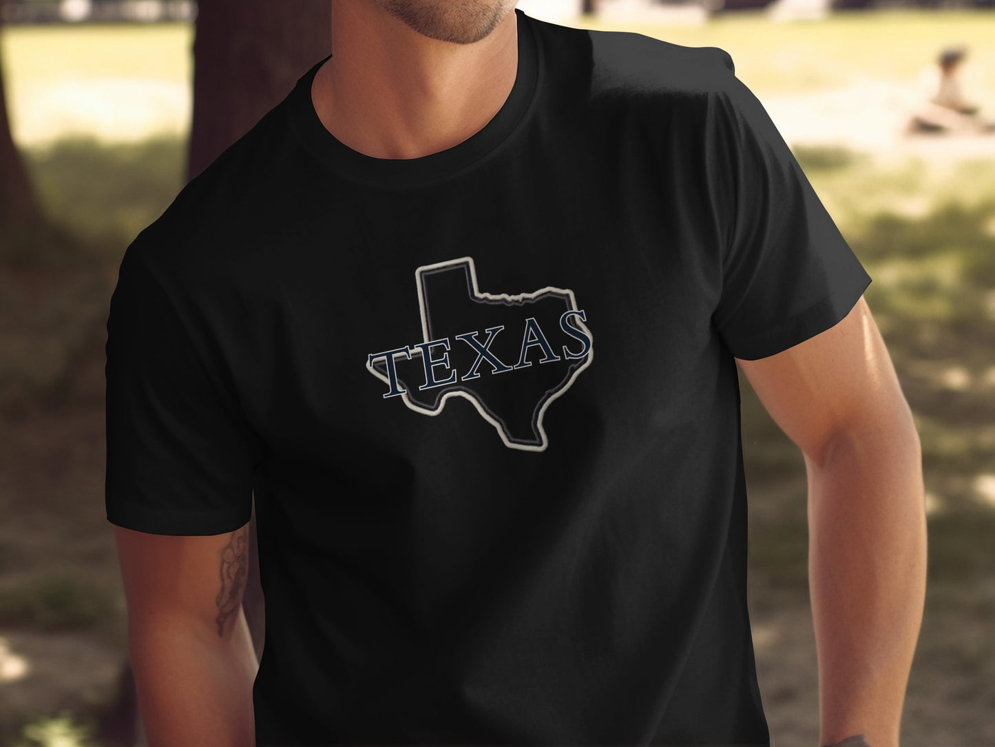 Black t-shirt with white outline of Texas and "TEXAS" text.