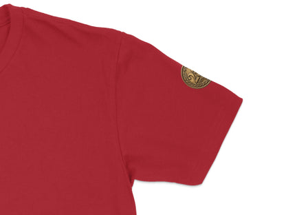 Red t-shirt sleeve with circular emblem detail on the upper arm.